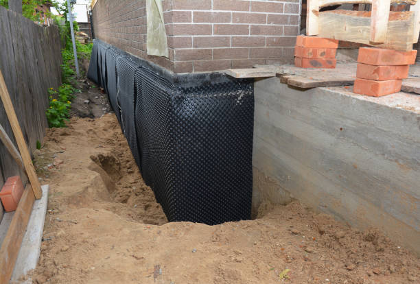 Happy homeowners after waterproofing job in Jasonville